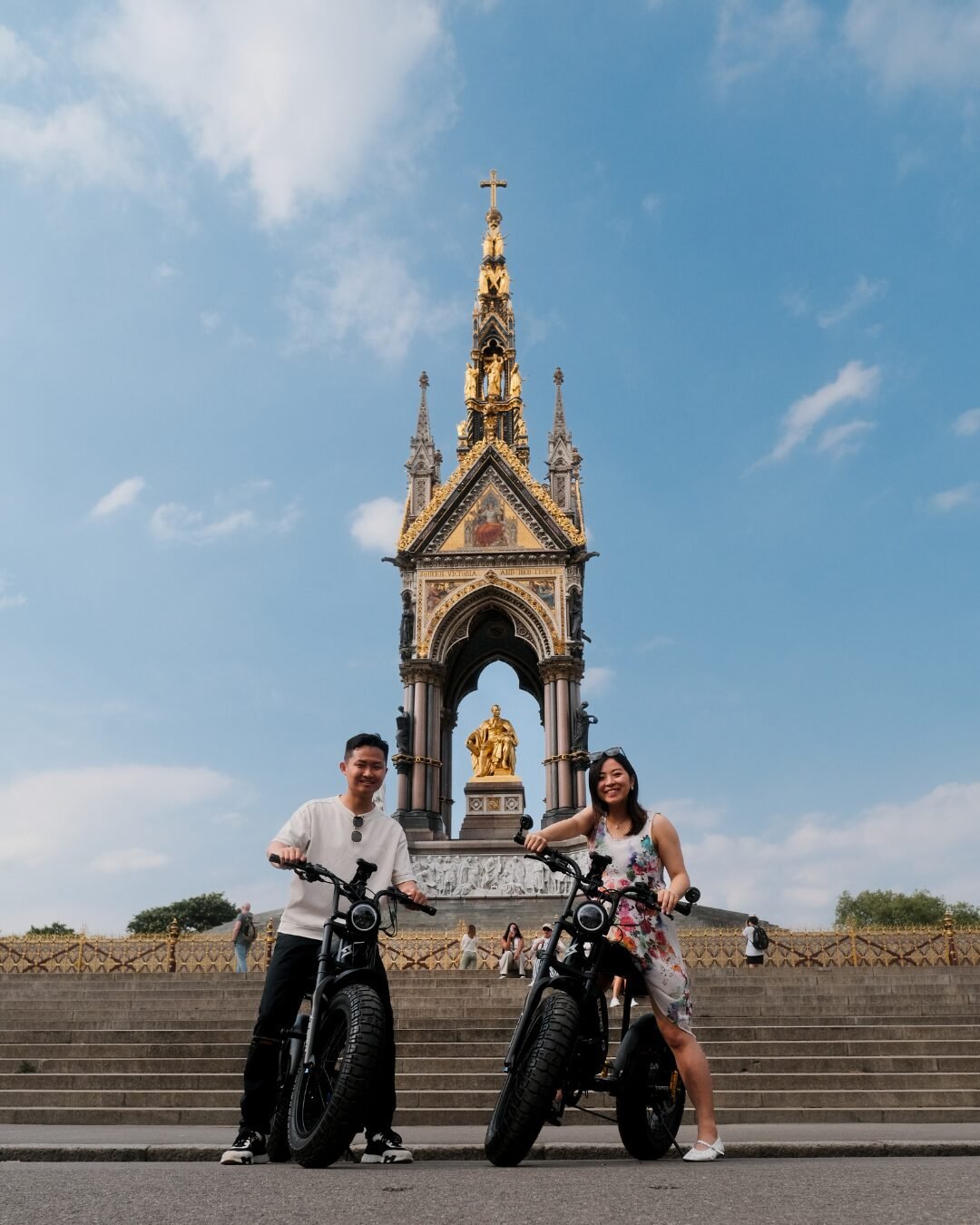 A couple riding Super73 e-bikes with FOF Bike Tours through Albert Memorial in London.