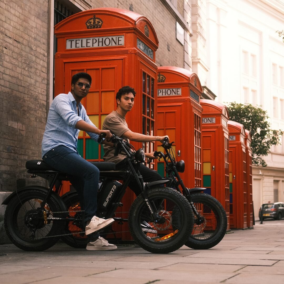Super73 e-bikes near famous london telephone booth during the best bike tours in London with FOF.