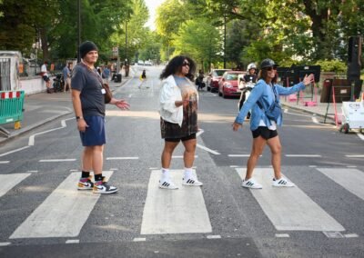 Guests recreating a Beatles-style photo on the Abbey Road crossing in London