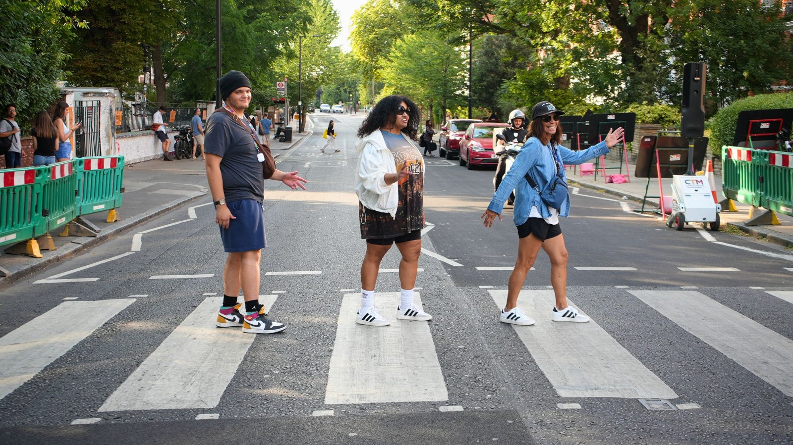 Guests recreating a Beatles-style photo on the Abbey Road crossing in London