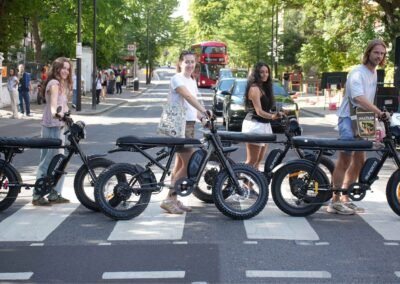 Guests on Super73 e-bikes posing at the Abbey Road crossing during a Beatles London e-bike tour