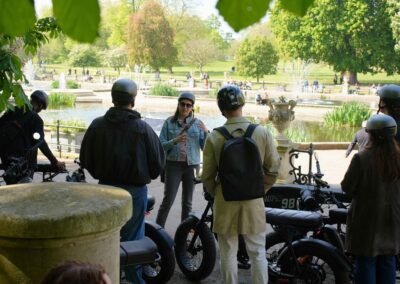 FOF Bike Tours guide speaking with guests on Super73 e-bikes at the Italian Gardens in London.
