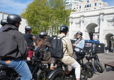 FOF Bike Tours guide sharing London stories with guests on Super73 e-bikes at Marble Arch.