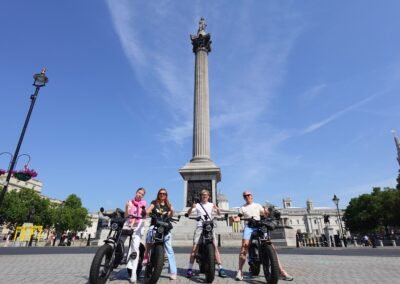 FOF Bike Tours guests riding Super73 e-bikes at Trafalgar Square in London.