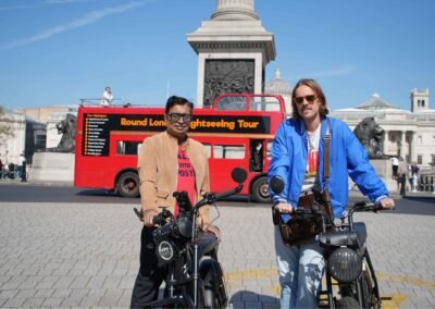 FOF Bike Tours guide and guest with Super73 e-bikes at Trafalgar Square in London.