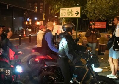 FOF Bike Tours guide sharing Dickens Christmas stories with guests on e-bikes near Borough Market in London.