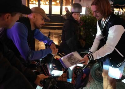 FOF Bike Tours guide sharing Dickens Christmas stories with guests during an e-bike stop in Covent Garden.